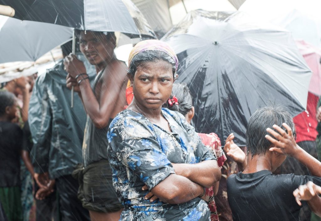 woman with crossed arms in the rain