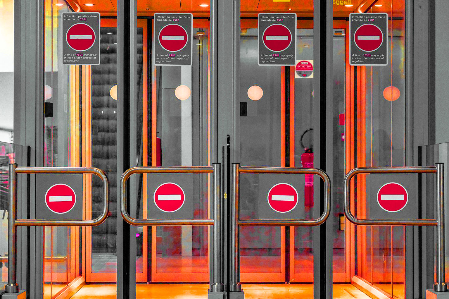 four security gates with the "no entry" symbol