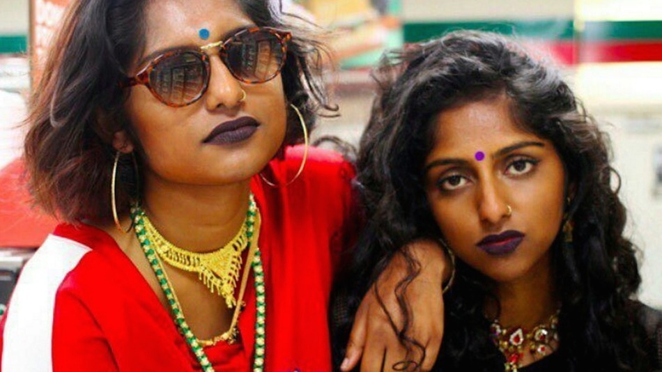 two fashionably dressed young women with medium brown skin