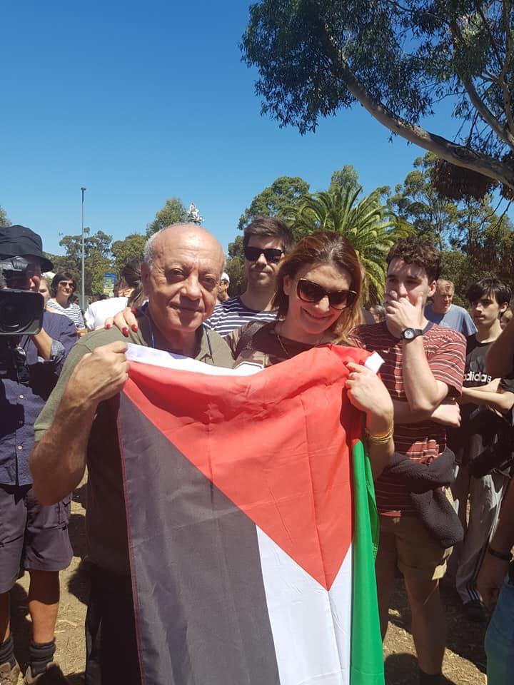 Saeed Maarsawe holding the Palestinian flag
